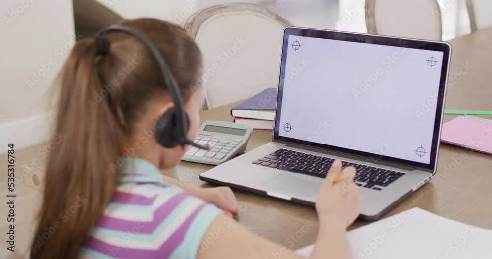 Happy caucasian girl having video call on laptop Happy caucasian girl having video call on laptop