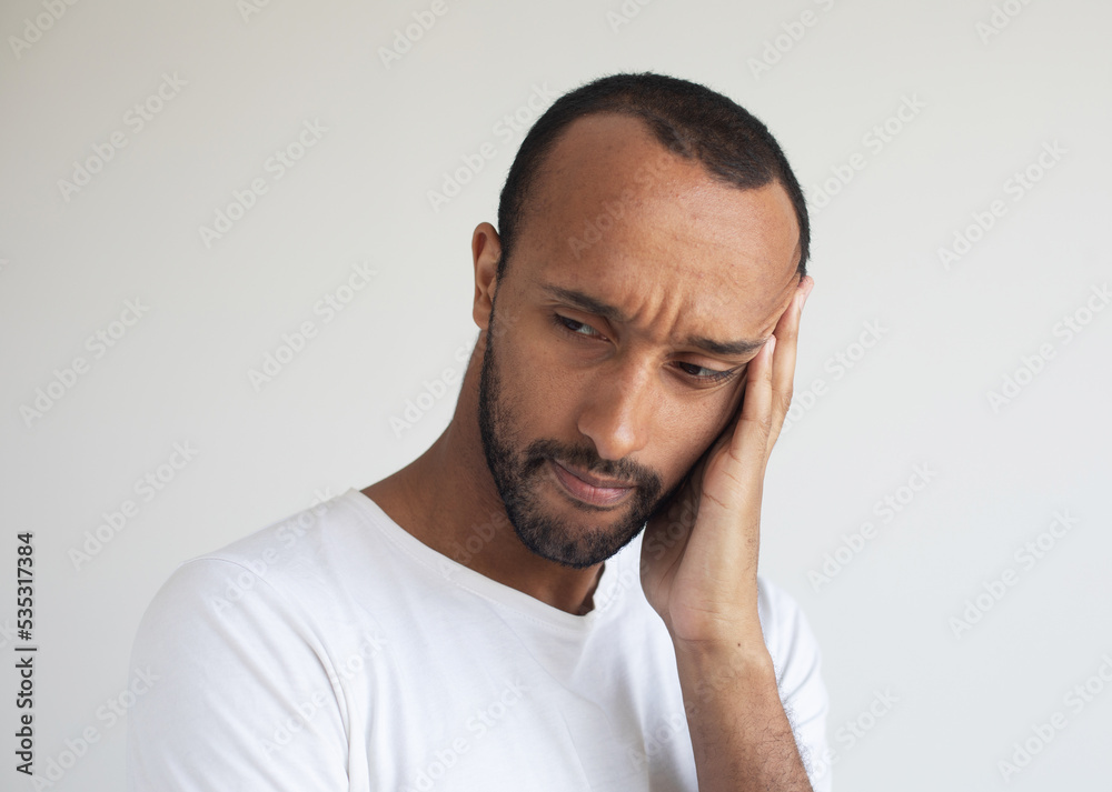 Stressed young african american man feel pain having terrible strong headache concept Stressed young african american man feel pain having terrible strong headache concept