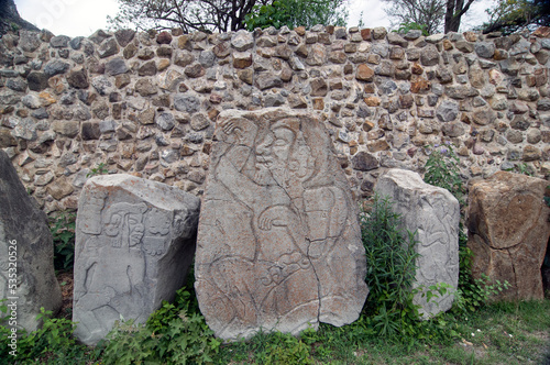 Hieroglyphs on the Zapotec ruis of Monte Alban in Oaxaca, Mexico photo