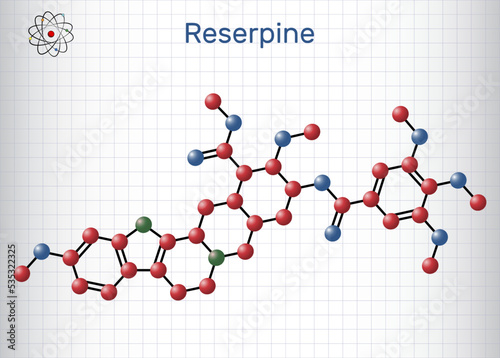 Reserpine alkaloid molecule. It is antihypertensive drug, used for the treatment of high blood pressure. Molecule model. Sheet of paper in a cage photo