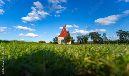 Old church in the summer field. Dobronice u Bechyne, Czech republic.