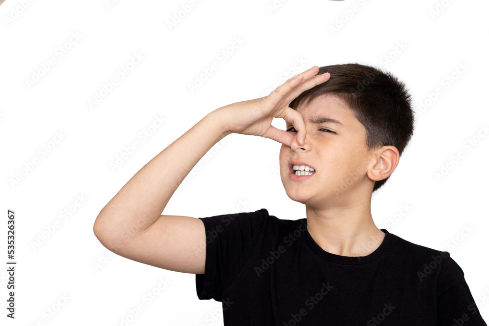 Little caucasian kid wearing casual clothes smelling something stinky and disgusting, intolerable smell, holding breath with fingers on nose. Bad smell. Isolated on the white background Little caucasian kid wearing casual clothes smelling something stinky and disgusting, intolerable smell, holding breath with fingers on nose. Bad smell. Isolated on the white background