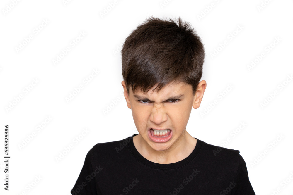 Young boy looking angry, clenching teeth against white background Young boy looking angry, clenching teeth against white background