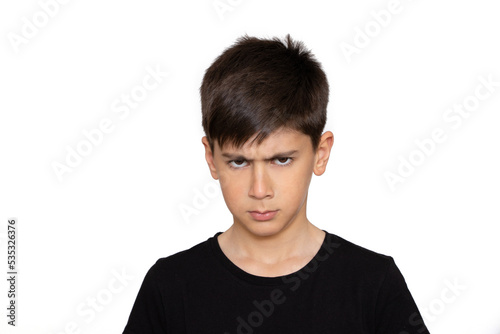Childhood, emotional, anger, hate and people concept - Angry boy in black t shirt. Isolated on the white background