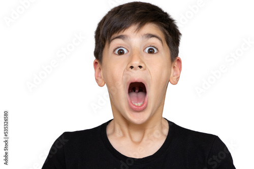 Little boy asian kid wearing casual black tshirt scared and amazed with open mouth for surprise, disbelief face. Isolated on the white background