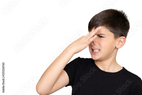 Little caucasian  kid wearing casual clothes smelling something stinky and disgusting, intolerable smell, holding breath with fingers on nose. Bad smell. Isolated on the white background