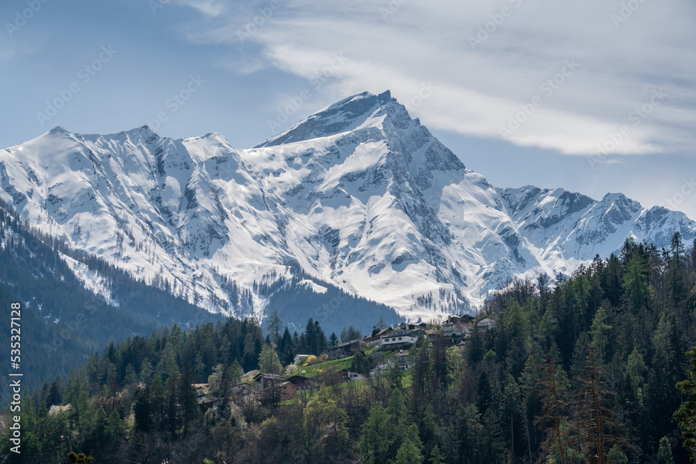 Piz Beverin (2998 m) and the village of Masein, Graubünden, Switzerland