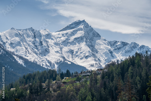 Piz Beverin (2998 m) and the village of Masein, Graubünden, Switzerland