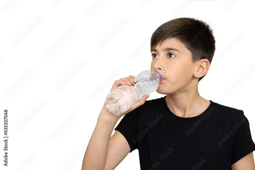 Photo of adorable young happy boy looking at camera.Child drinking pure water on the white background. Photo of adorable young happy boy looking at camera.Child drinking pure water on the white background.