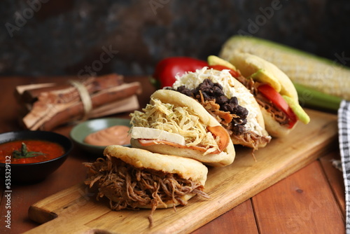 arepa lunch or breakfast from colombia or venezuela filled with traditional ingredients photo