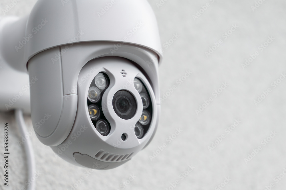 Security CCTV camera in office or shop building for protection against thieves, close up with copy space Security CCTV camera in office or shop building for protection against thieves, close up with copy space
