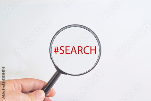 Search text in magnifying glass. search , research idea concept.