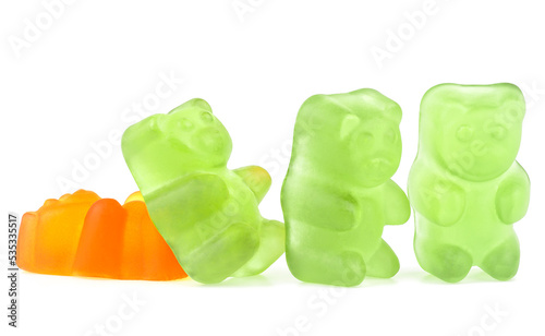 Colorful jelly gummy bears isolated on a white background. Green and orange tasty jelly candies.