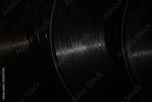 Black vintage vinyl records  closeup. Retro vinyl record texture or background