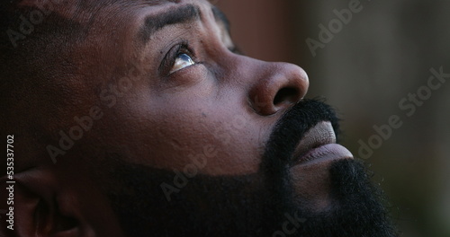 African man seeking God help. Person looking at sky wanting FAITH and HOPE