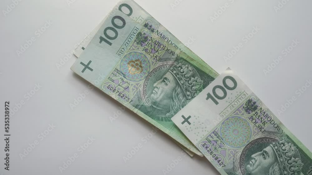 Counting 100 polish money and 200 polish money at home on the white table. Stop motion animation close-up cash money. Zloty Counting 100 polish money and 200 polish money at home on the white table. Stop motion animation close-up cash money. Zloty