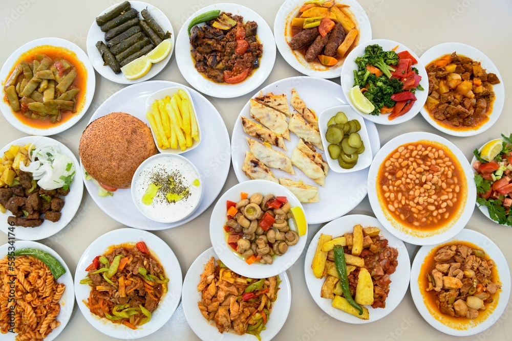 Table scene of assorted take out or delivery foods. Traditional Turkish cuisine. Various Turkish meal and appetizers. Top down view on a table.