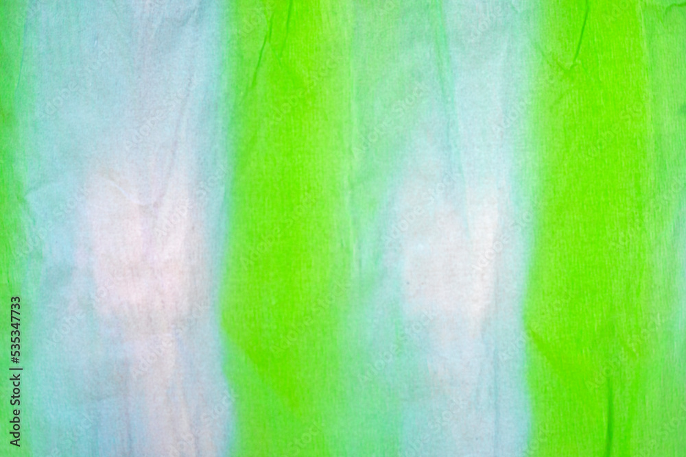 abstract blurred light green background from corrugated paper with a gradient, horizontal.