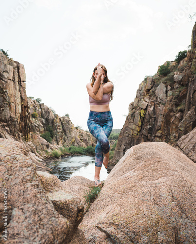 Yogi Woman Practicing Yoga Lesson Outdoors in the mountains with various poses proven to be an effective exercise and fitness regimen