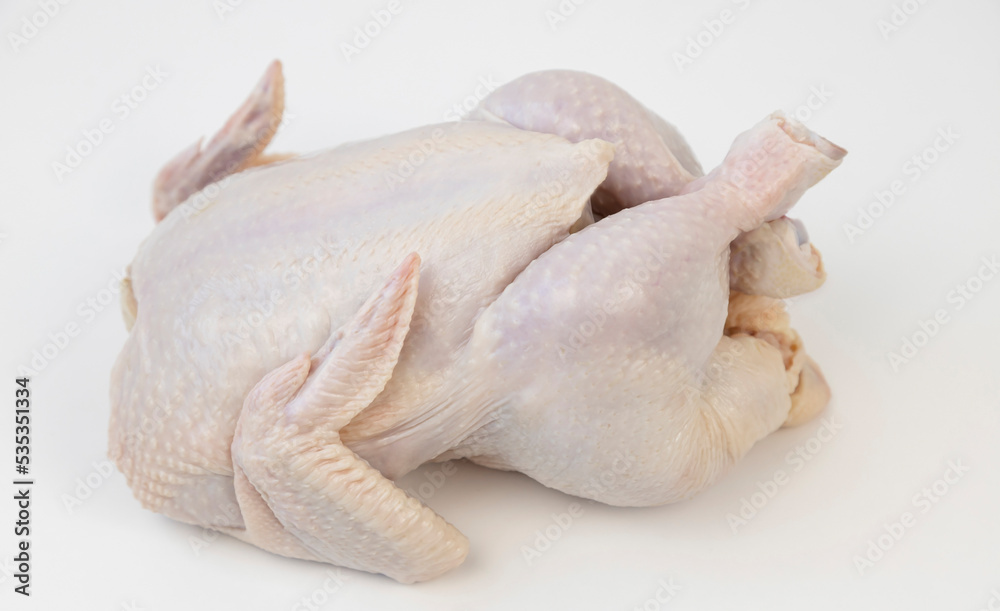 Top view. Whole fresh raw chicken isolated on white background. Top view. Whole fresh raw chicken isolated on white background.