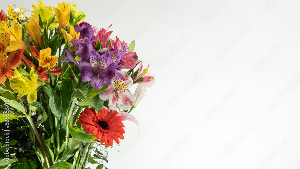 Beautiful multicolored flower bouquet on white background and closeup, with lilies, chrisantemos, pompom, wildflower, etc.