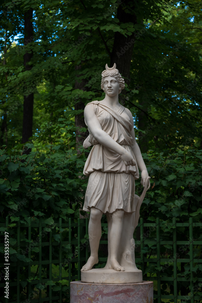Marble Sculpture of Roman Goddess Artemis Diana in the Summer garden, Saint Petersburg; Russia