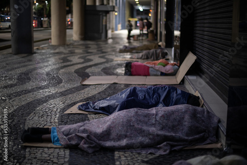 homeless people sleeping in the streets of rio de janeiro, brazil.
