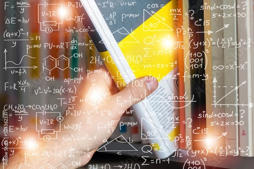 Naklejka Equations floating in the background, books, representing the learning teaching or scientific notes