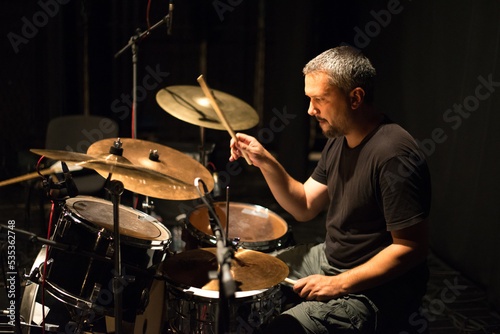 Canvas Print Drummer in rock band recording music in the professional recording studio