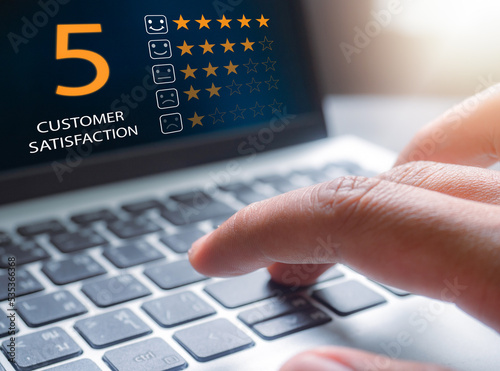 Customer service evaluation concept. Customer service and Satisfaction rating five star very impressed.Emoticon smiling in satisfaction. rating to service experience.