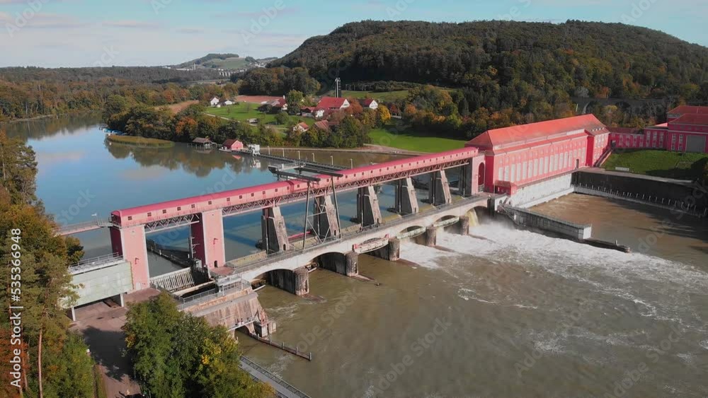 River dam, aerial view. Dam with flowing water through gates on Rhine river River dam, aerial view. Dam with flowing water through gates on Rhine river