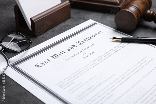 Last will and testament with pen on grey table, closeup