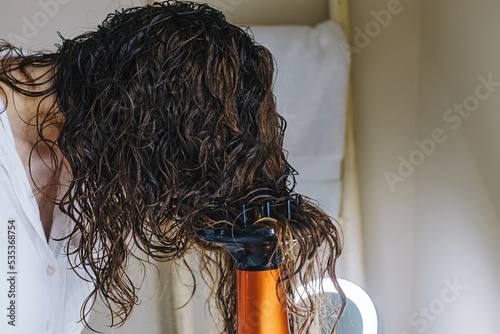 Drying hair according to curly method for hair styling photo