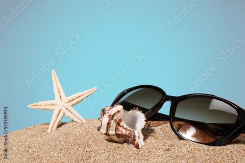 Trendy glasses in plastic frame on beach with palm leaves. Optic store discount. Eyewear fasion promotion.