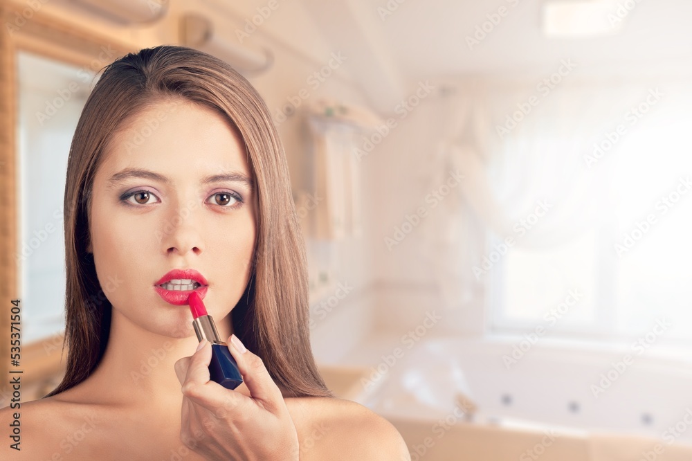 Daily Makeup. Smiling Young Female Applying Makeup In Bathroom, Beautiful Happy Woman Using New Cosmetics Daily Makeup. Smiling Young Female Applying Makeup In Bathroom, Beautiful Happy Woman Using New Cosmetics