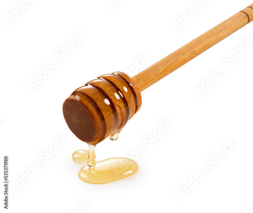 Honey and wooden honey dipper on white background.