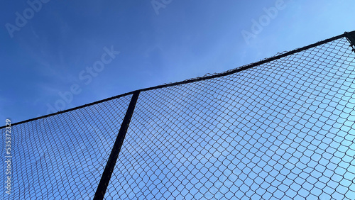 fence against blue sky