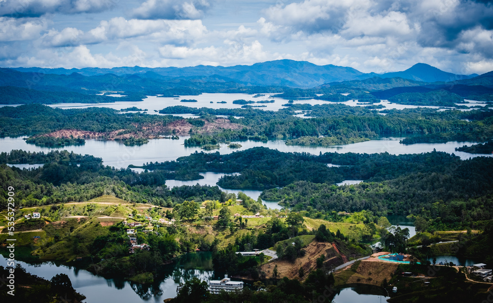 Aerial Drone Vision Above Guatape Lakes and Islands near Medellin Colombia Green Unpolluted Town with Blue Water Zoom Out of Natural Landscape, Travel Destination in Latin America