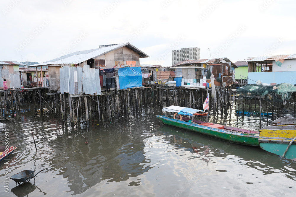 A rustic stilt village of Kampung Tinosan in Sandakan during low tide time. A rustic stilt village of Kampung Tinosan in Sandakan during low tide time.