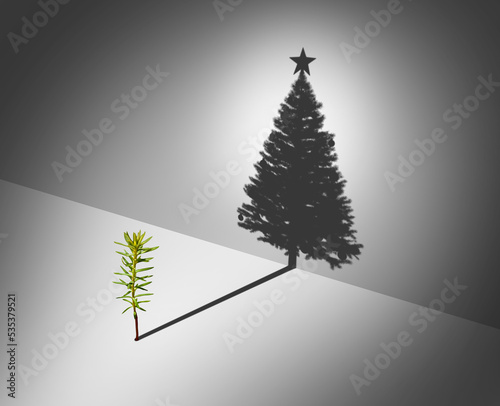 Holiday Season Aspirations concept as a pine tree sapling dreaming of glory casting a shadow shaped as a tall decorated Christmas tree with a star as a surreal winter