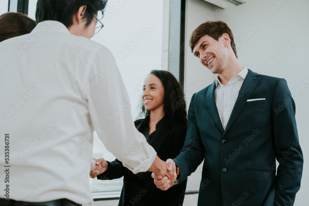 professional business people shaking hands in the office. Finishing successful meeting. businessman persons handshake with partner teamwork, concept of partnership approve a job agreements deal professional business people shaking hands in the office. Finishing successful meeting. businessman persons handshake with partner teamwork, concept of partnership approve a job agreements deal