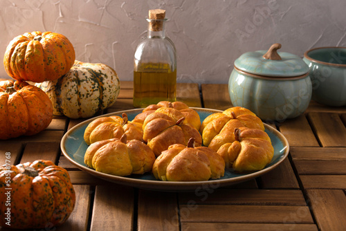 Pumpkin buns on a wooden table