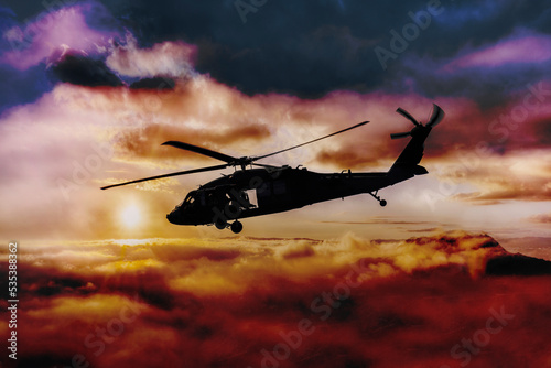 Military helicopter flying through a stormy sky
