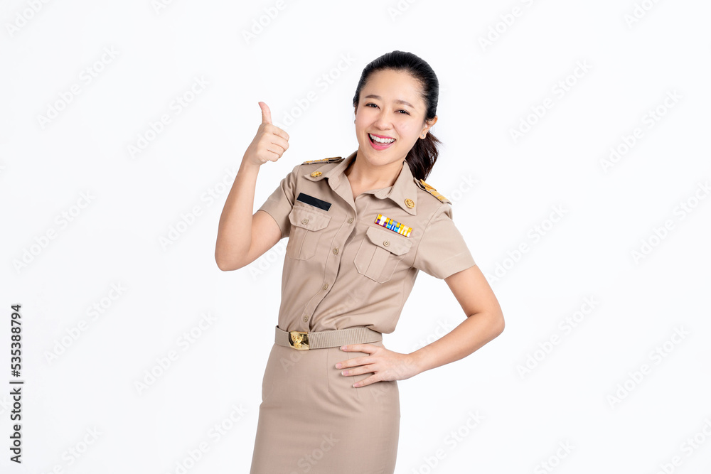 Smiling young asian teacher showing thumbs up isolated on white background Smiling young asian teacher showing thumbs up isolated on white background
