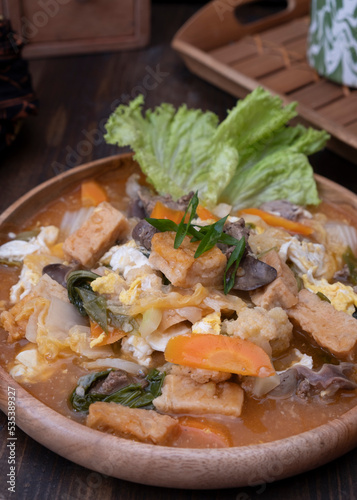 Cap cay Semarangan, Local Indonesian Chinese food from Semarang, Central Java. It made from vegetables, eggs and chicken, with specialty in its red sauce. Selective Focus 
