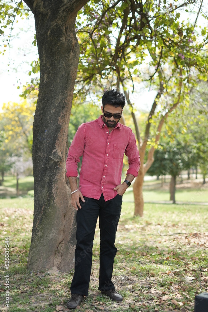 a couple wearing clothes doing fun a park