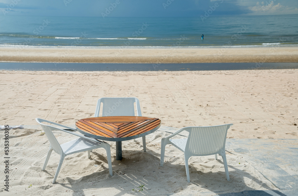 beach chairs at tropical beach, Thailand.