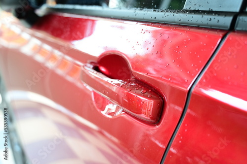 door handle of red car, transportation industry