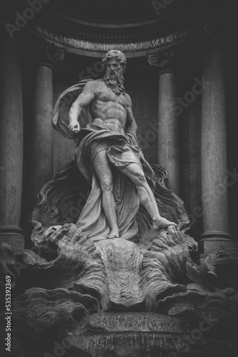 Close-up monochrome of Oceanus statue from the Trevi Fountain in Rome, Italy photo