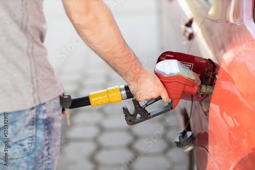 Man filling up his oil tank